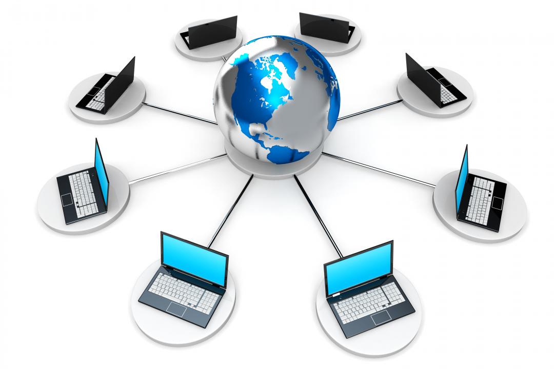 0914_network_of_laptops_connected_to_globe_stock_photo_Slide01