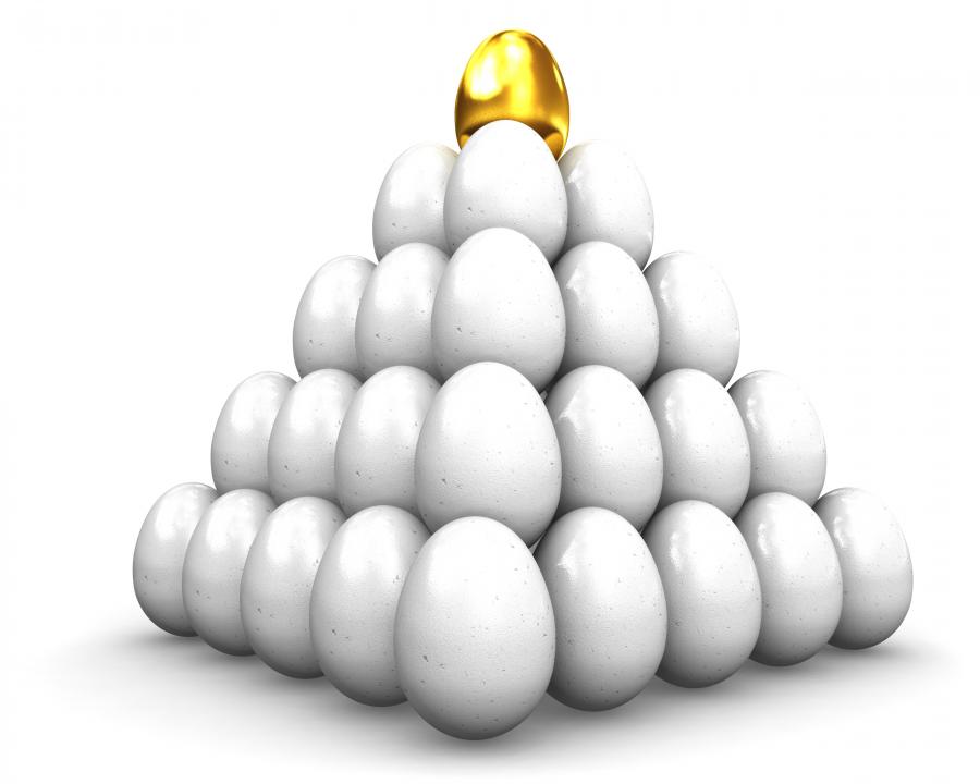 Golden egg on top of white eggs stock photo Slide01