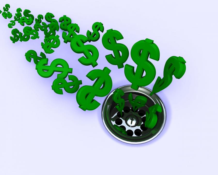 Green dollar symbols going in drain shows financial crisis stock photo Slide01