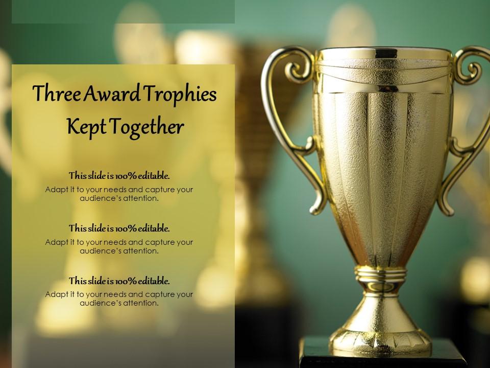 Three award trophies kept together Slide01