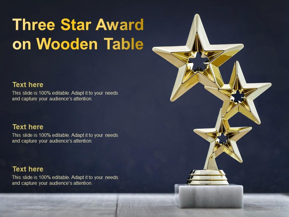 Three star award on wooden table Slide01