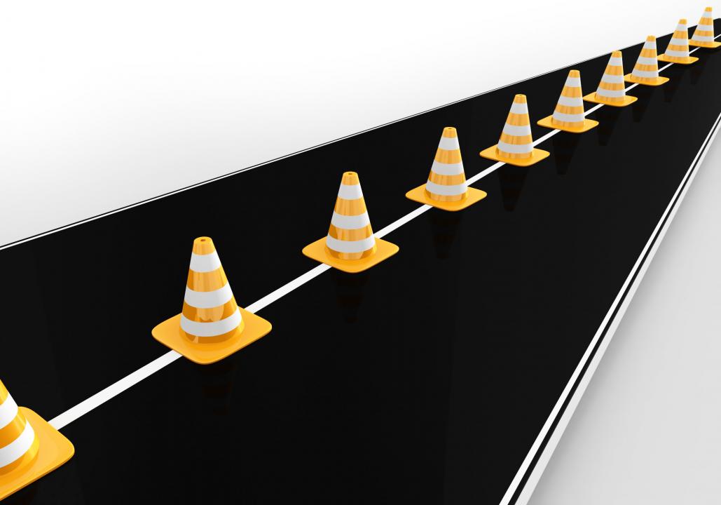 Traffic cones on roadmap for business stock photo Slide01