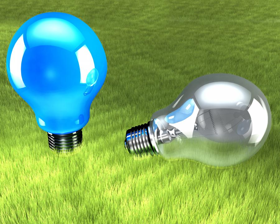 two_bulbs_on_green_background_stock_photo_Slide01