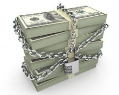 0914 bundles of dollars secured by padlock and chain stock photo