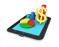 0914 business charts and dollar symbol on pc tablet stock photo