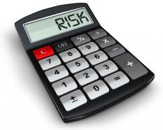 0914 calculator with word risk on display stock photo