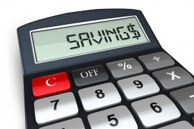 0914 Calculator With Word Savings Symbolizing Financial Security Stock Photo