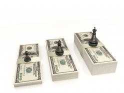 0914 chess figures black king queen and pawn standing on dollars stock photo