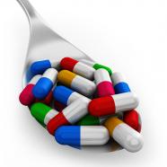 0914 Colorful Capsules On Silver Spoon For Healthcare Stock Photo