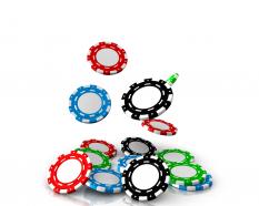 0914 falling red blue green and black poker chips game graphic stock photo