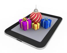 0914 gifts and christmas ball on pc tablet stock photo