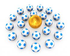 0914 golden football in blue footballs for leadership stock photo