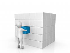 0914 man pushing a cube into its place stock photo