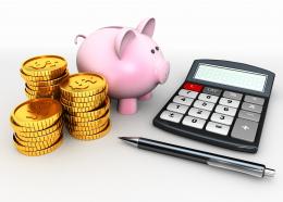 0914 piggy bank with coins calculator pen for savings stock photo