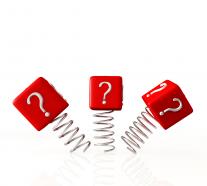 0914 question marks on red cubes and springs graphic stock photo