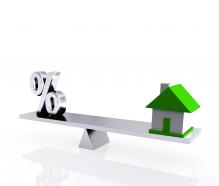 0914 seesaw with percent symbol and house real estate image stock photo