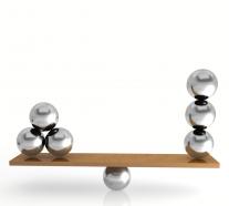0914 silver balls on balancing scale stock photo