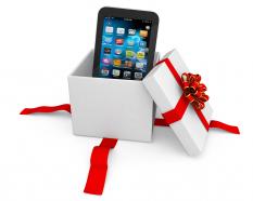 0914 smartphone in the gift box with red ribbons stock photo