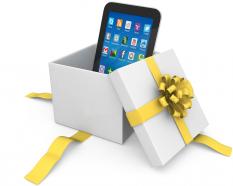 0914 Smartphone In The Gift Box With Yellow Ribbon Stock Photo