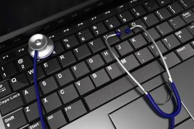 0914 stethoscope on laptop keyboard for diagnosis stock photo