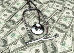 0914 stethoscope on pile of dollars for checking stock photo
