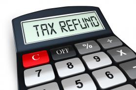 0914 tax refund text on display of calculator stock photo