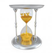 0914 tax word inside the hourglass with sand stock photo