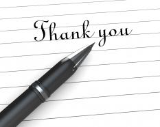0914 thank you note on paper with pen stock photo