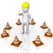 1114 3d man in between circle of traffic cones stock photo