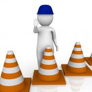 1114 3d man with blue cap and traffic cones stock photo