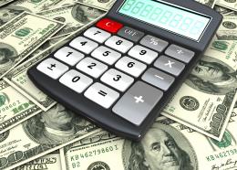 1114 calculator on us currency notes stock photo