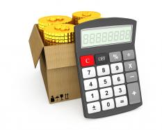 1114 coins in carton box with calculator stock photo