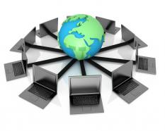 1114 globe and laptops for computer networking stock photo