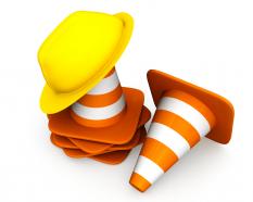 1114 traffic cones with helmet for road safety stock photo