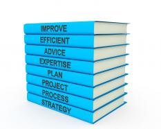 3d blue books tower with multiple texts stock photo