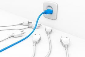 3d graphic of blue plug in socket with five white plugs besides stock photo