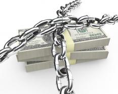 3d graphic of chain obove dollar bundle stock photo