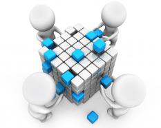 3d men building cube shows teamwork stock photo