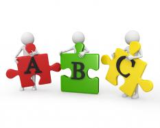 3d people holding abc puzzle pieces stock photo