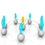 3d people standing over balls with one man in center to show network leadership stock photo