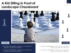 A kid sitting in front of landscape chessboard