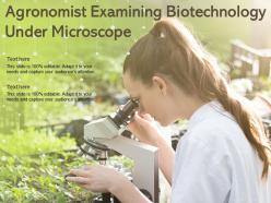 Agronomist examining biotechnology under microscope