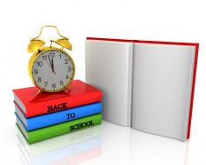 Alarm clock on books for preschool education stock photo