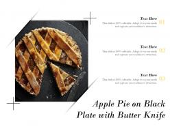 Apple pie on black plate with butter knife