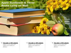 Apple sunflower and three books lying on wall 1