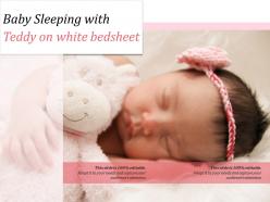 Baby sleeping with teddy on white bedsheet