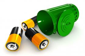 Batteries in green recycle bin stock photo