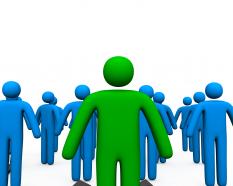 Blue colored 3d men with one in green as leader stock photo