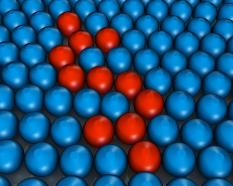 Blue colored metal balls with few red balls in between stock photo