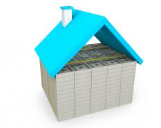 Blue roof hut made with base of dollars stock photo